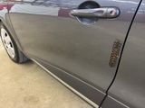 a close up of a car door handle with a sticker on it