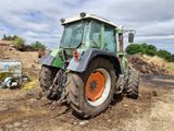 a tractor that is sitting in the dirt