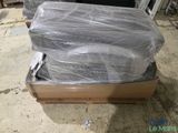 a pile of luggage sitting on top of a pallet