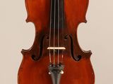an old violin with a bow hanging from it ' s neck