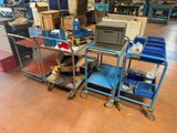 a blue cart that is sitting in the middle of a room