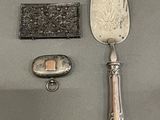 a silver spoon and a silver spoon with a silver handle