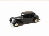 a black toy car sitting on a white surface