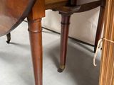 an image of a small table with a drawer underneath it
