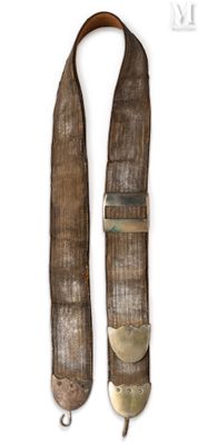 an old belt with a metal buckle on a white background