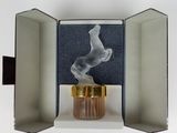 a small box with a cigarette in it on a white surface