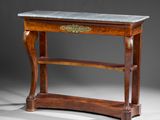 an antique console table with marble top