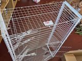 a cage that is sitting on the floor in a room