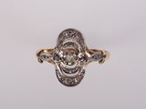 a close up of a gold and diamond ring on a white background