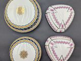 four plates with different designs on them sitting on a table
