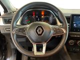 the interior of a car with a steering wheel and dashboard controls