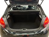 the back of a car with its trunk open and the back of the car with its trunk open