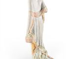 figurine of a woman with a basket of flowers and a dog