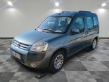 a picture of a blue van parked in a garage