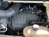 a picture of a car engine with its hood open