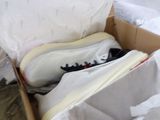 a box with a pair of shoes inside of it
