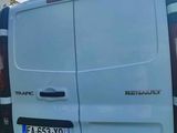 a white van that is parked on the side of the road