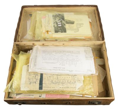 a suitcase with papers and papers inside of it