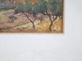 a picture of a painting hanging on the wall above a bed