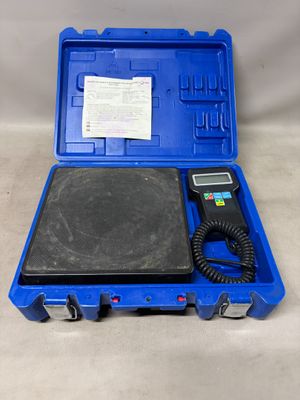 a blue case holds a digital scale and a receipt
