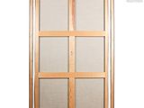 a close up of a sliding glass door with a wooden frame