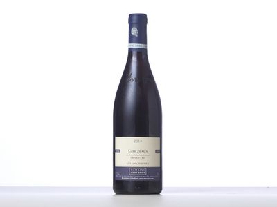 a bottle of wine sitting on top of a table