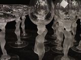 six wine glasses sitting in a row on a table
