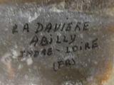 a close up of a piece of glass with writing on it
