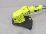 a close up of a yellow and black electric polisher on a gray surface