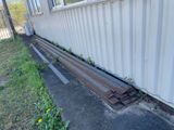 a metal rail laying on the side of a building