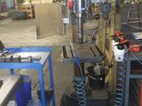 a picture of a machine in a factory with a lot of work on it