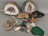 several different types of rocks and stones on a gray surface