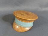 a small wooden box with a lid on a gray background