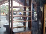 a glass display case in the middle of a room