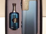 a bottle and a lighter in a box on a table
