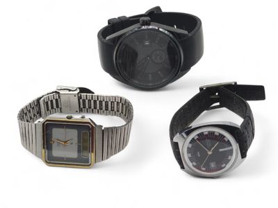 three different types of watches are shown on a white surface