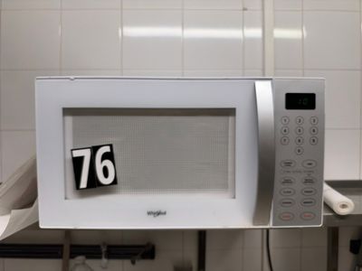 a microwave that has a number on the front of it