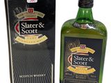 a close up of a bottle of scotch whisky next to a box
