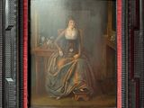 painting of a woman seated at a table with a cat in her lap