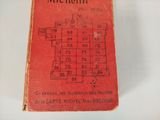 an old red book with numbers on it sitting on a table