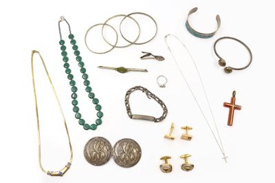 a lot of jewelry that is laying out on the table