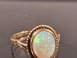 a close up of a ring with a white oplite in it