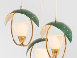 three green and white lamps hanging from the ceiling