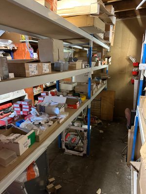 many boxes and boxes on the shelves in the room