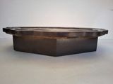 an image of a large metal bowl sitting on top of a table
