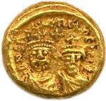 une pièce d'or sur laquelle sont représentés le visage d'un homme et celui d'une femme