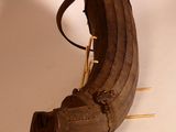 an old baseball glove with a bat on a table