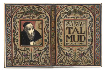 un vieux livre sur lequel figure l'image d'un homme barbu