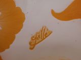 a close up of a plate with orange flowers on it