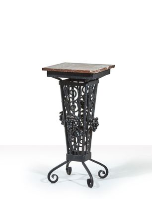 a black iron table with a marble top on a white background